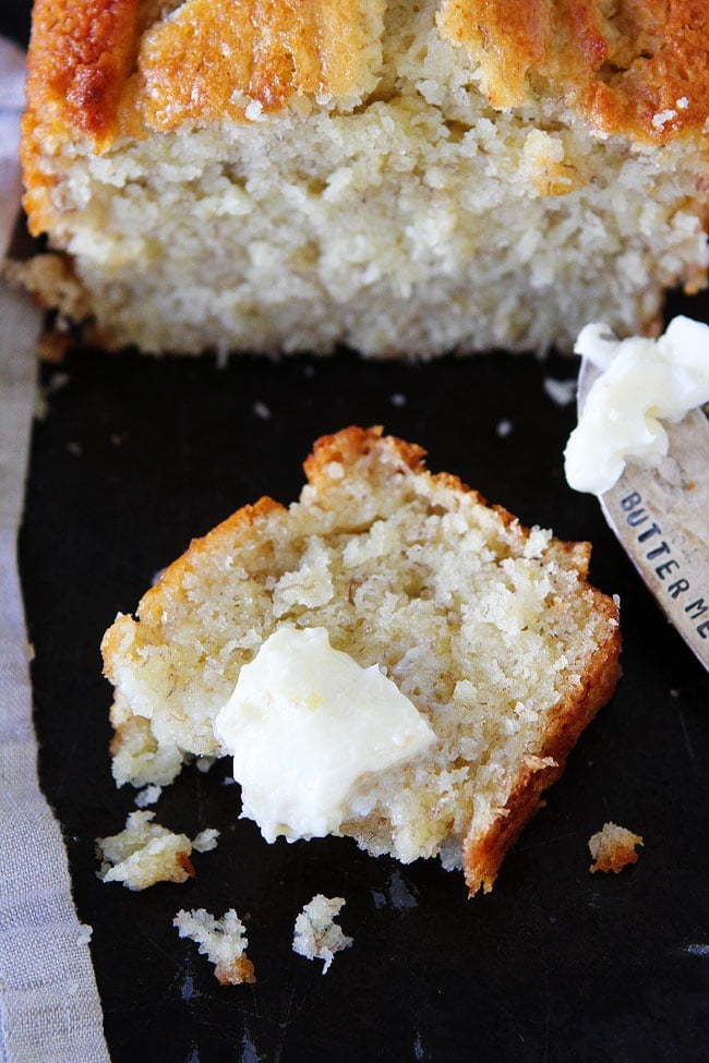 Buttermilk Banana Bread slice with butter. 