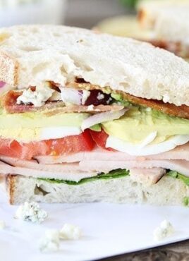 sliced cobb salad sandwich with eggs and bleu cheese