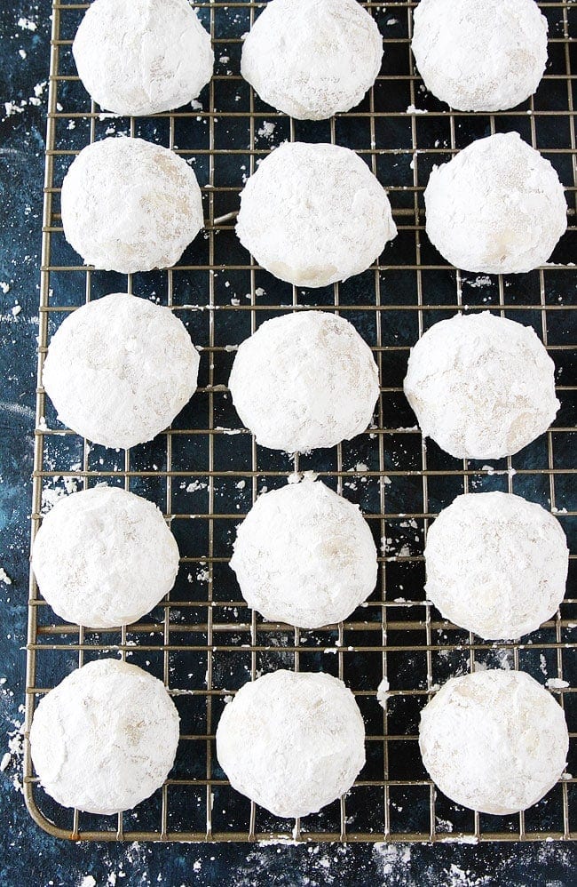 Mexican wedding cookies on cooling rack. 
